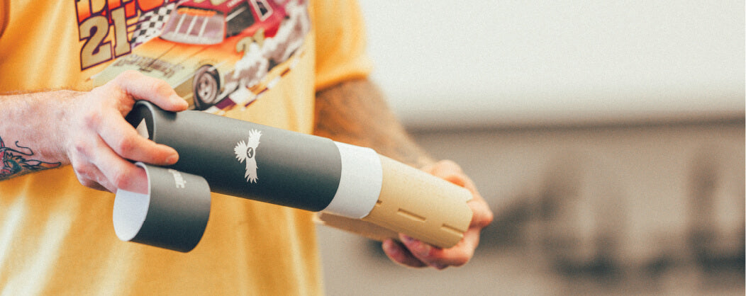 Wide Shot of a pair of Tribus Thick Grips being unboxed by an athlete.